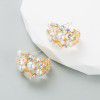Cross border Fashion Earrings: light luxury alloy inlaid with pearl flowers, silver needle earrings, female high-level sense, personalized walk show earrings