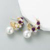Cross border Fashion Earrings: light luxury alloy inlaid with pearl flowers, silver needle earrings, female high-level sense, personalized walk show earrings