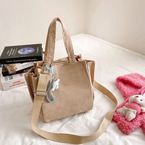 The manufacturer wholesales women's Cross messenger hand sail cloth bags, Korean corduroy women's bags, and Bento bags. One can be customized for distribution